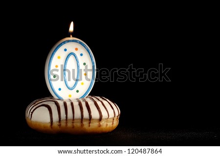 Candle 0 in the doughnut. Birthday background or the new beginnings concept.