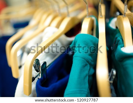 Hangers in the clothes store. Shallow dof.
