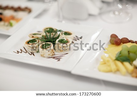 Plate of gourmet appetizers displayed on a table at a restaurant or catered function. Nice shallow depth of field