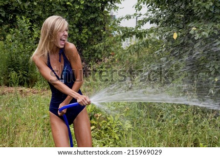 Beautiful girl blonde pours water
