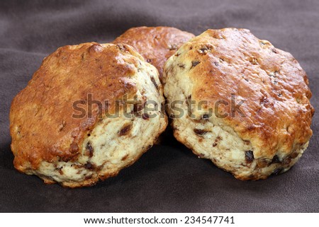 closeup of three date and maple syrup scones