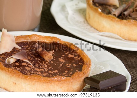 chocolate filled pastry tarts with chocolate swirls and chunks