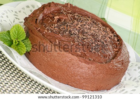 chocolate fudge cake covered with chocolate cream topping