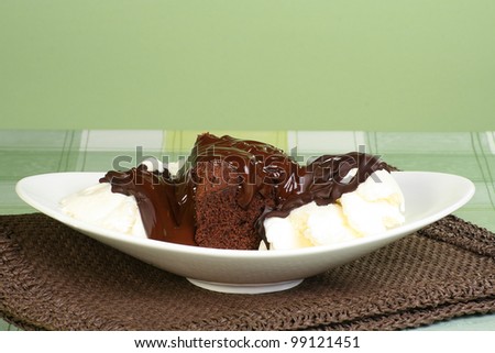 slice of chocolate fudge cake with ice cream