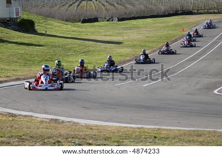 A line up of go karts in a race