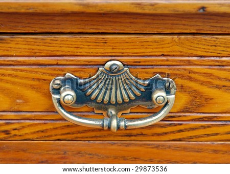 Antique Drawer Handle on a Wooden Drawer