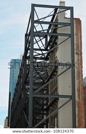 Supporting structure for historical building facade during new building construction in Melbourne, Australia