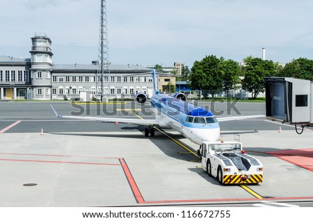 Airplane being towed to ramp at airport