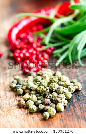 Mix of spices, herbs and vegetables on wood table