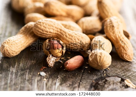 Peanuts in shell on wooden table