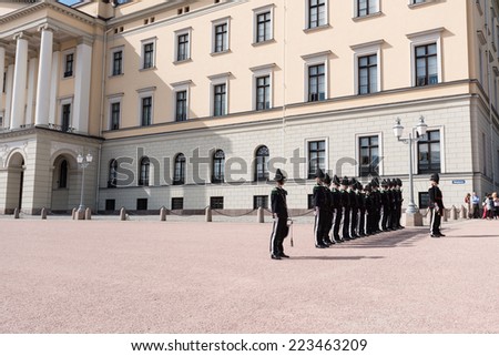 OSLO - AUGUST 28: In Oslo, His Majesty King's Guard keeps The Royal Palace and Royal Family guarded 24 hours day. Every day  1330 hrs,  is Change of Guards outside Palace. Pictured on August 28, 2014