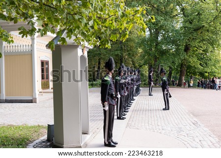 OSLO - AUGUST 28: In Oslo, His Majesty King\'s Guard keeps The Royal Palace and Royal Family guarded 24 hours day. Every day 1330 hrs,  is Change of Guards outside Palace. Pictured on August 28, 2014