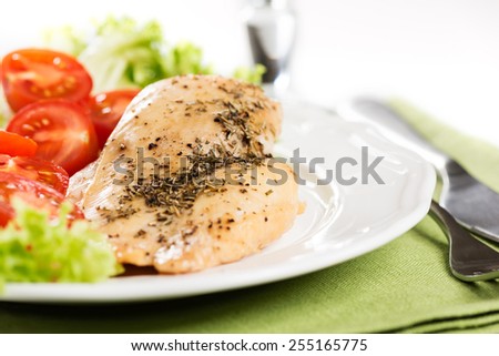 Chicken meet with tomatoes in plate