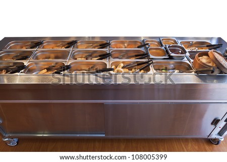 Chinese buffet warmer display with variety of food in containers isolated on white