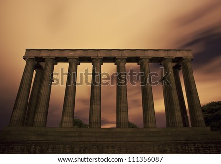 Ancient Parthenon like colonnade monument. The National Monument on Carlton Hill in Edinburgh, Scotland. Night scene. Long exposure