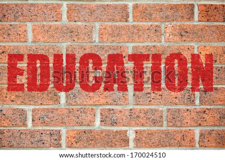 Red EDUCATION inscription on brick wall surface pattern as a wallpaper concept for designers background applying
