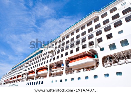 Side of white modern mega cruise ship
