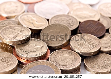 Heap of different british pound sterling coins. Macro