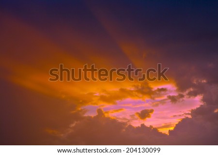 Sunbeam ray light shining through cloud sky at twilight. Dramatic background symbolizing spiritual heaven or hope of trust in god