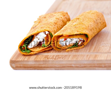 Wrap sandwich with feta cheese tomatoes and basil