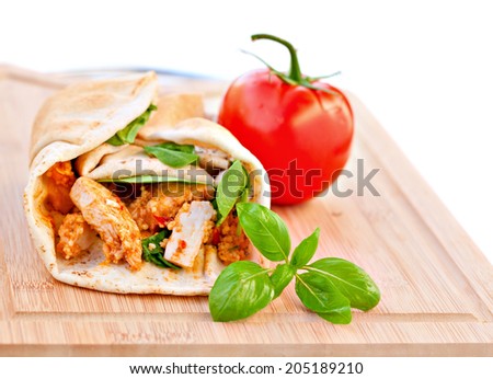 Wrap sandwich Moroccan style with couscous, chicken, tomatoes and basil