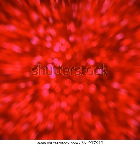 Defocused red abstract christmas background of blurred lights with bokeh and zoom effect. Idea to use as February 14th St. Valentine day or Christmas design