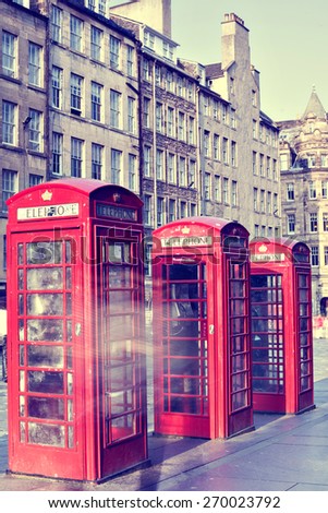Retro old red telephone booths on Royal mile street in Edinburgh, capital of Scotland, United Kingdom. Vintage style photograph