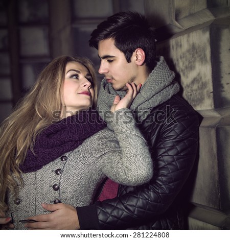 Attractive young stylish couple in love dressed in warm cloths outdoors
