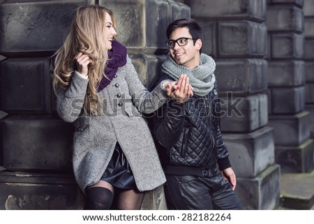 Attractive young stylish couple in love dressed in warm cloths outdoors
