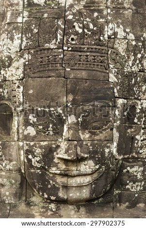 Ancient stone faces of king Jayavarman VII at The Bayon temple, Angkor, Cambodia