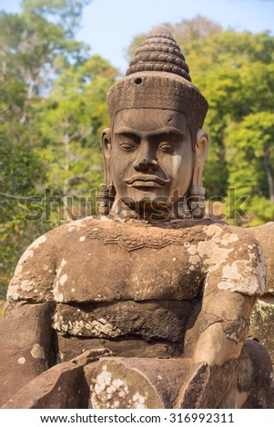 Statue of ancient khmer warrior head at Angkor Wat, part of Khmer temple complex, Siem Reap, Cambodia.