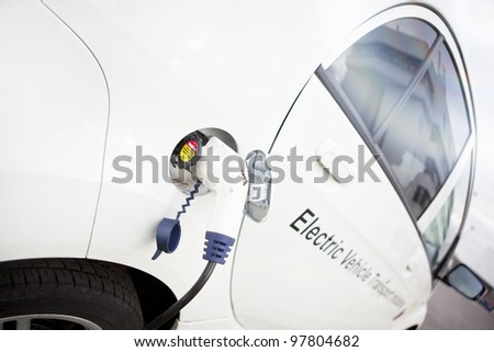 Cord hanging down from gas tank location on this electrical vehicle