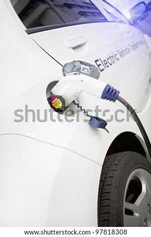 Cord hanging down from gas tank location on this electrical vehicle