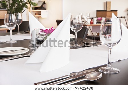 Formal dining table set up with flower in luxury restaurant
