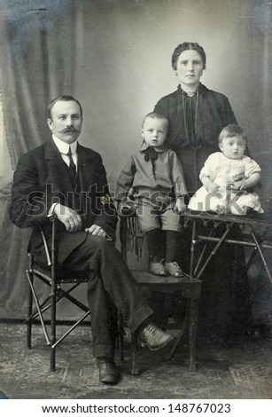 RUSSIAN EMPIRE - CIRCA 1900:Vintage family portrait. Mother, father and children. Nostalgic picture. Circa 1910. Russian Empire, beginning of 20th century.