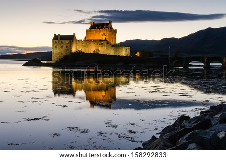 Eilean Donan castle at dusk / Eilean Donan the iconic Scottish castle at dusk