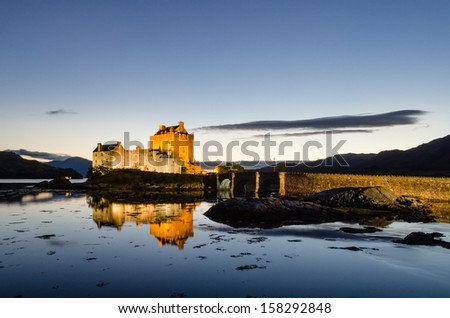 Illuminated Eilean Donan castle / Eilean Donan the iconic Scottish castle at dusk