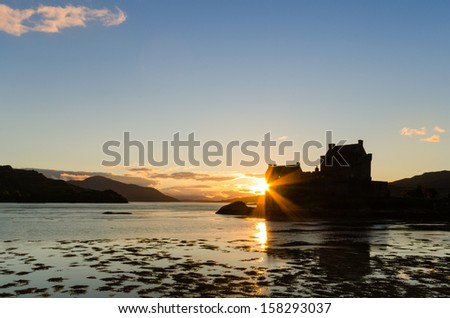 Sunburst on Eilean Donan castle / Eilean Donan the iconic Scottish castle at dusk