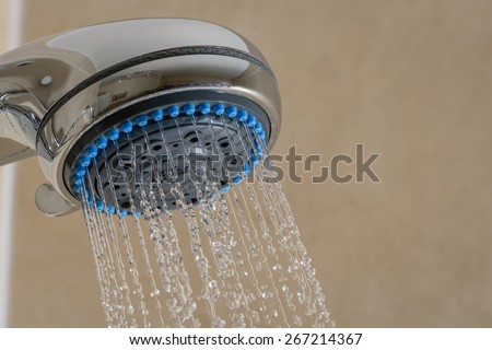 Close-up of Shower Head / Shower Head with running water in bathroom