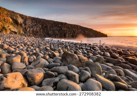 Cullernose Point in early morning / The golden light of early morning lighting the sea washed rocky beach at Cullernose Point in Northumberland
