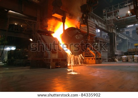 Casting of hot iron in foundry 2
