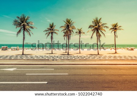 Sunny day with Palms on Ipanema Beach in Rio de Janeiro, Brazil. Light leak applied