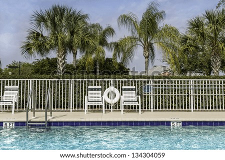 Swimming pool against palms in South Florida