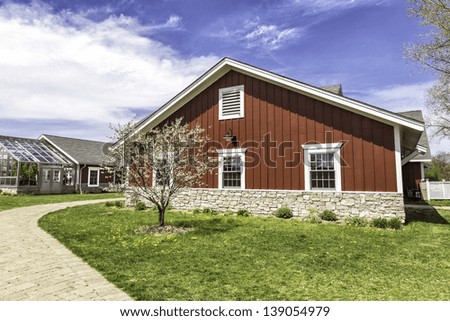 American countryside red farm with green house