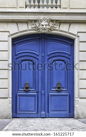 Wood arch entry door in the street of Paris, France