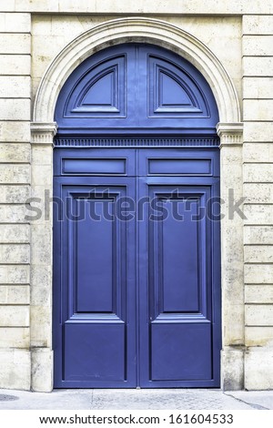 Wood Arch Entry Door In The Street Of Paris, France