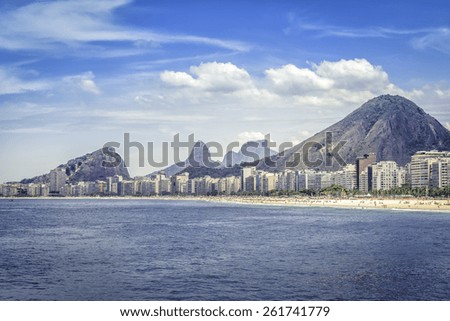 Copacabana beach with people and buildings on hot summer day in Rio de Janeiro, Brazil
