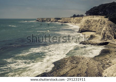 Empty Beach with steep cliffs - vintage view