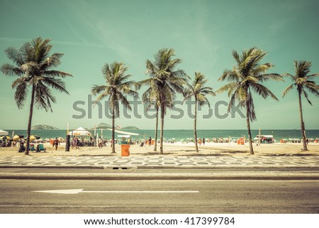 Sunny day with Palms on Ipanema Beach in Rio De Janeiro, Brazil. Vintage colors