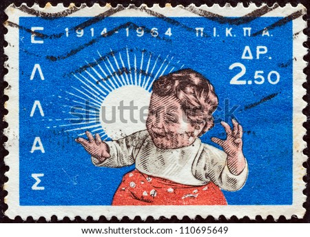 GREECE - CIRCA 1964: A stamp printed in Greece issued for the 50th anniversary of National Institution of Social Welfare (P.I.K.P.A.) shows a child, circa 1964.